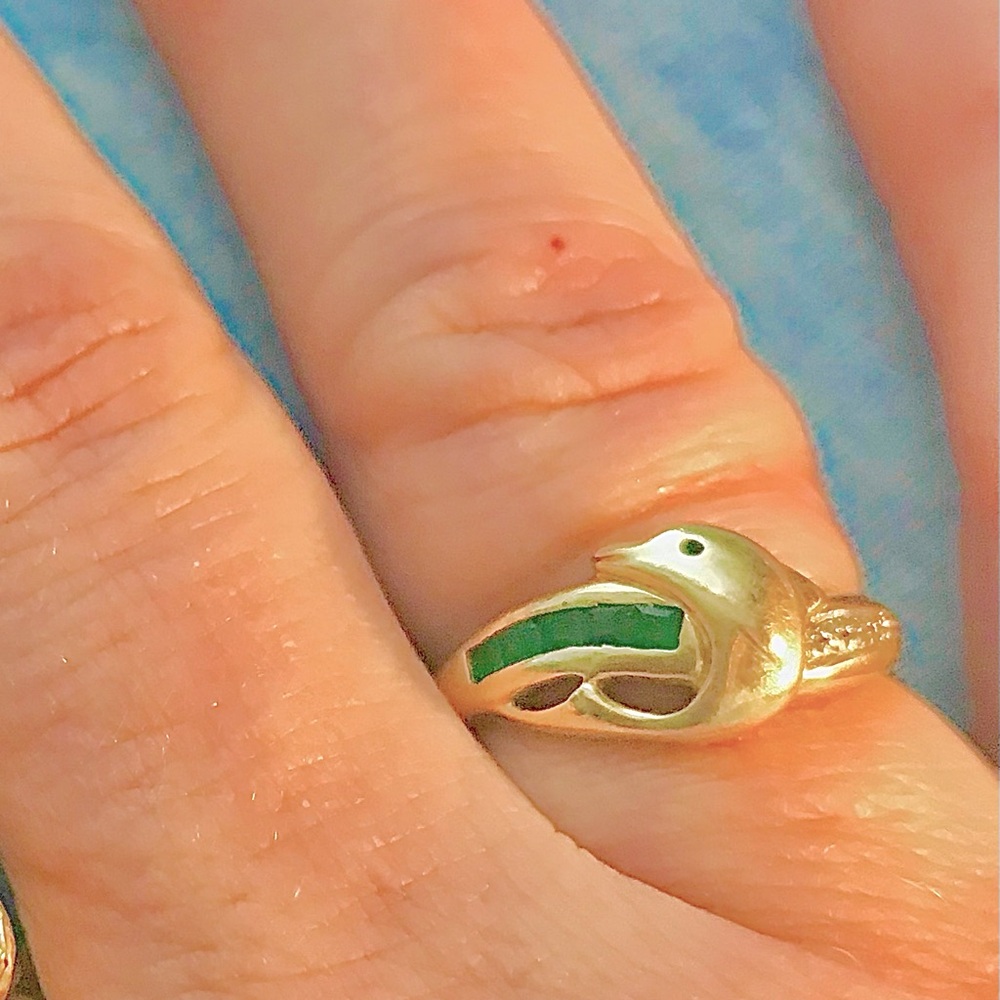 Gold dolphin ring with emeralds and diamonds